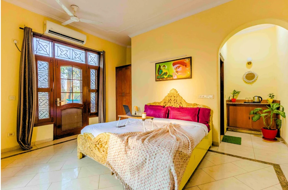 Bedroom with decorative bed frame and air conditioning