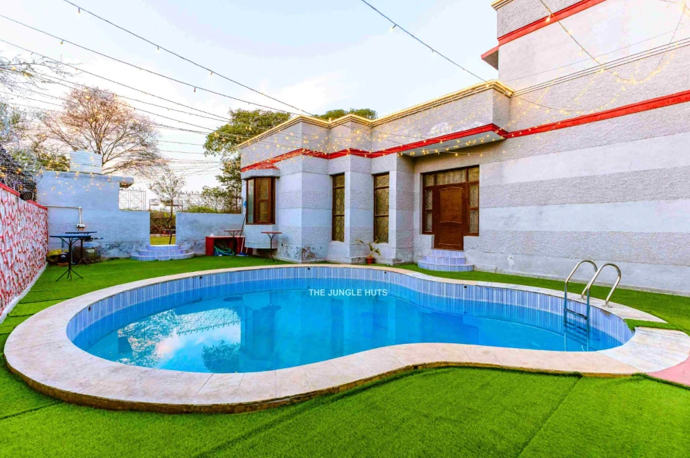 Outdoor swimming pool beside the resort building
